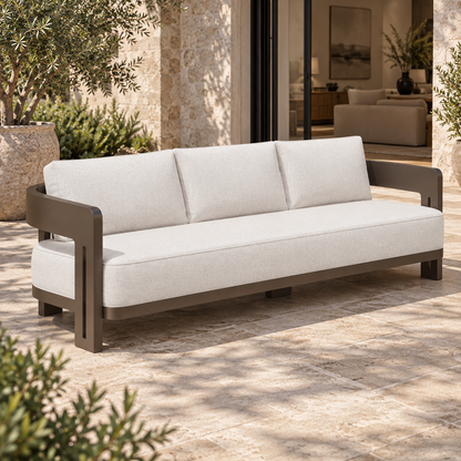 Serein aluminium sofa, left diagonal beside a furnished home