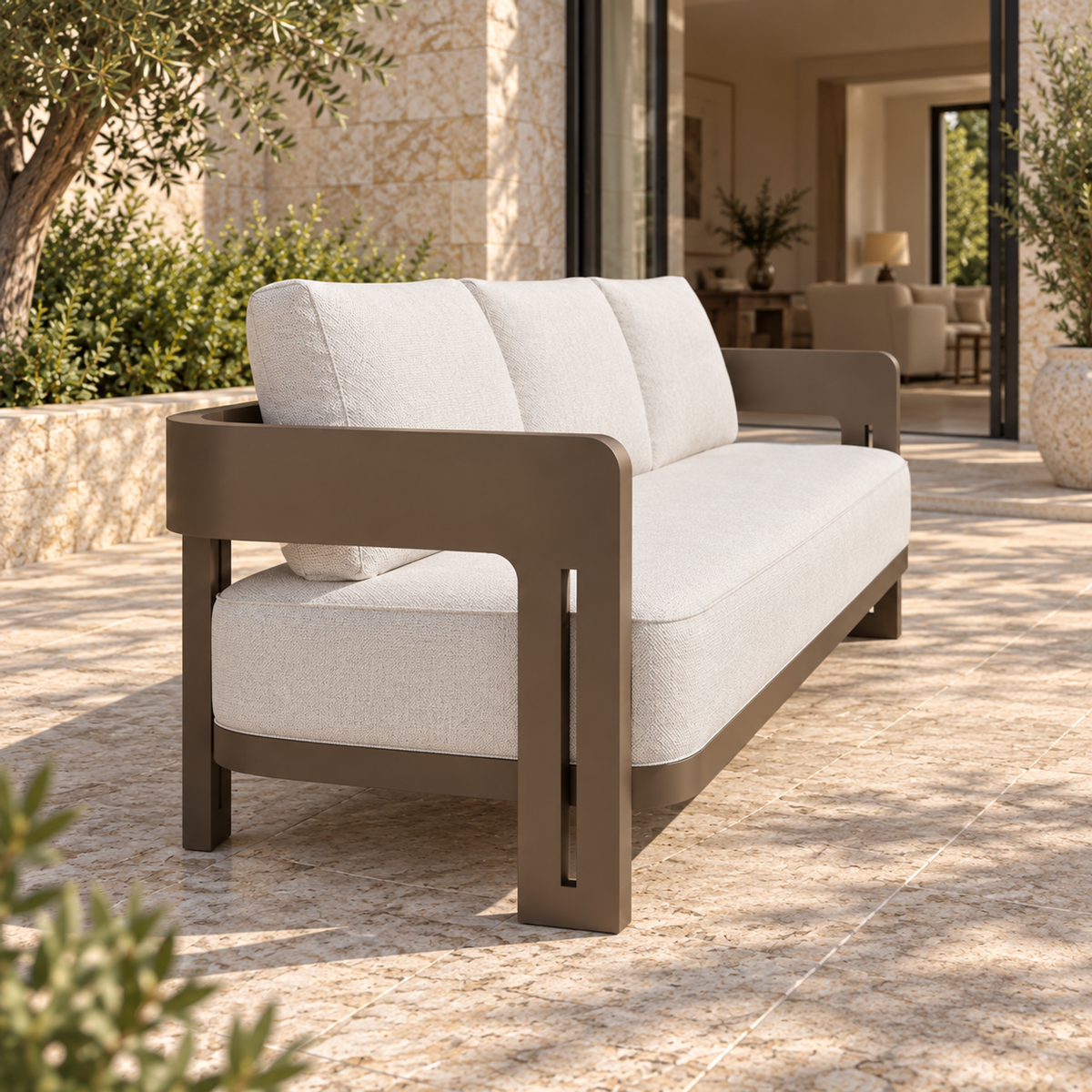 Serein aluminium sofa, left-end view beside a furnished home