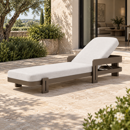 Lifestyle view: Serein Sun Lounger in Aluminium, elevated foot-left view beside a furnished home