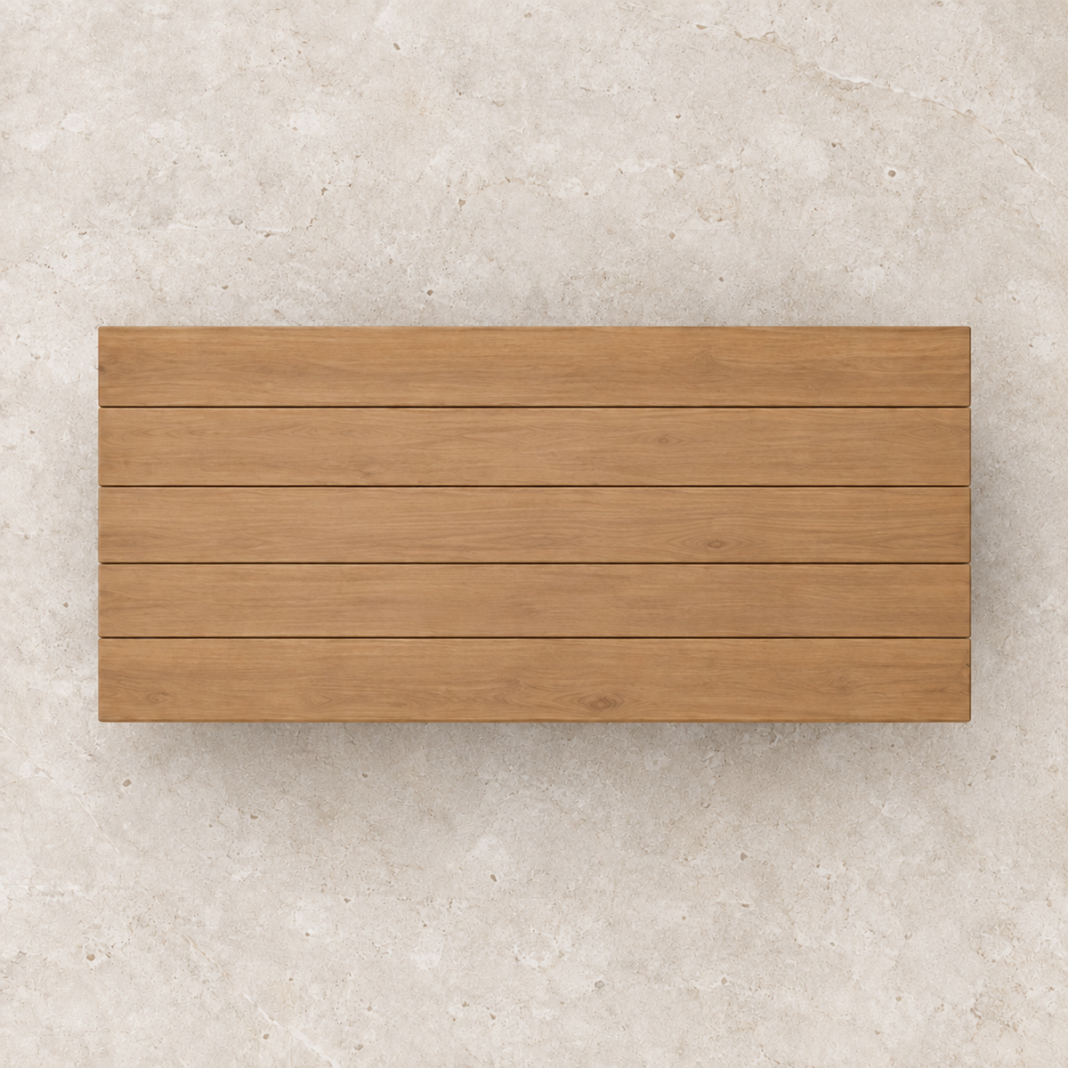 Vela teak coffee table, overhead view on a stone terrace