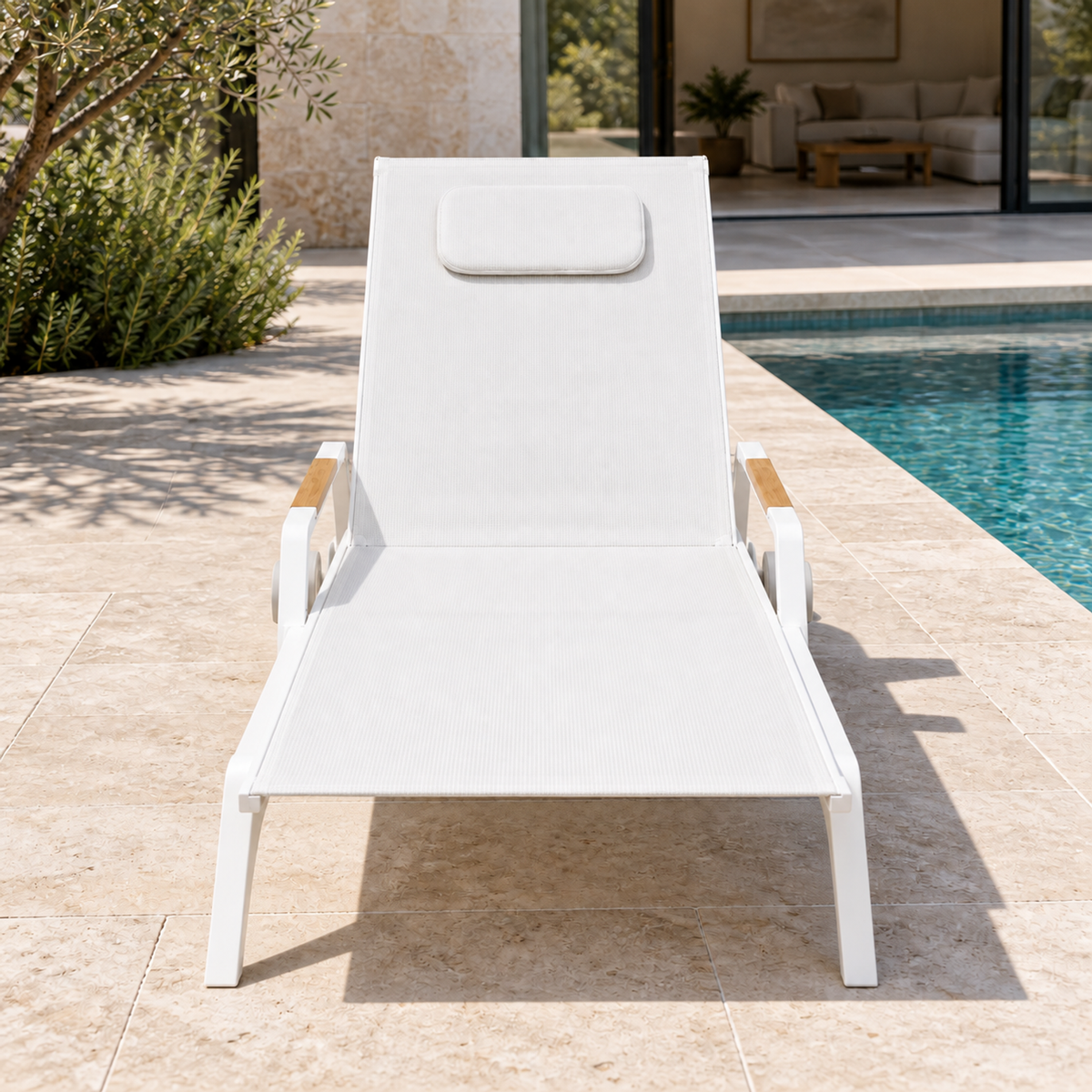 Vela aluminium poolside sun lounger, foot-end view beside a home pool