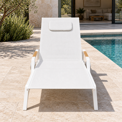 Vela aluminium poolside sun lounger, foot-end view beside a home pool
