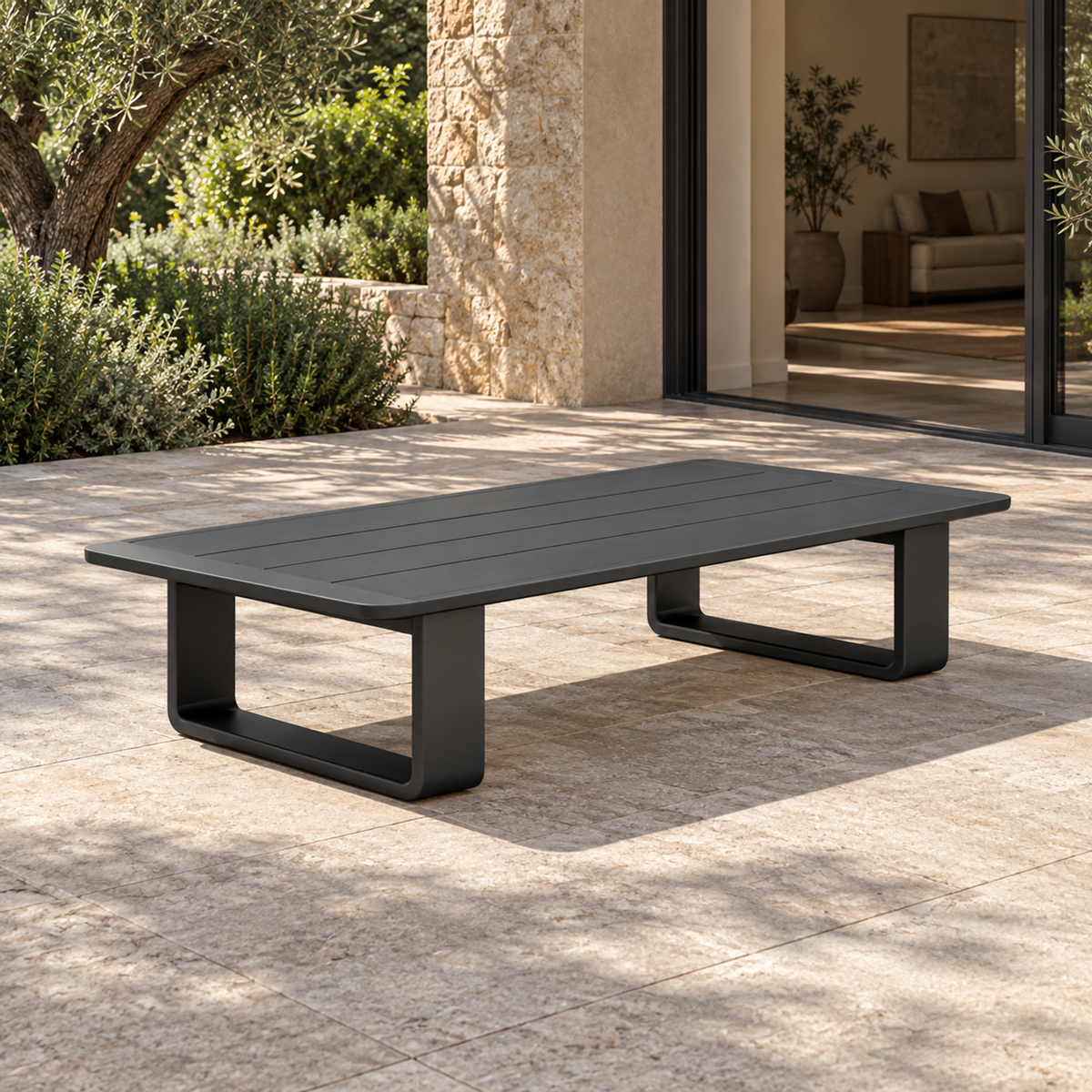 Lifestyle view: Zenia aluminium coffee table, left diagonal view beside a furnished home