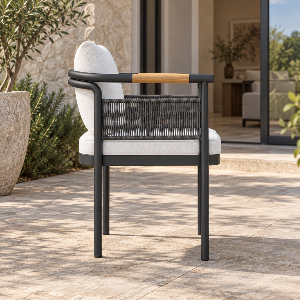 Zenia aluminium dining chair, side view on a furnished home terrace